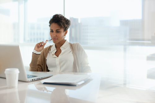 woman reading about how property management companies often use a zillow rental manager for rental listing site needs when advertising rental properties