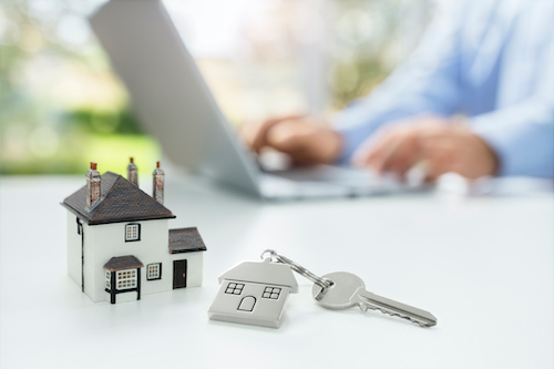 man using a property management software to streamline posting to rental listing sites for prospective renters